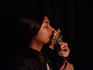 Picture of girl smelling flower