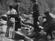 A group of young people from the early 1900's standing on river rocks - year unknown, photo taken by Hall Studios