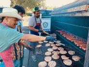 Guys cooking burgers