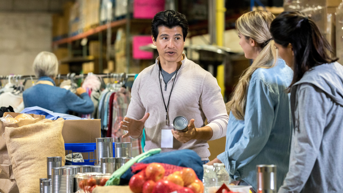 People looking at food and clothing